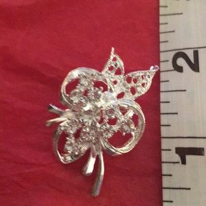 Silver tone with rhinestones clover shaped brooch